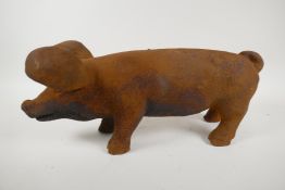 A cast iron garden figure of a pig, 17" long