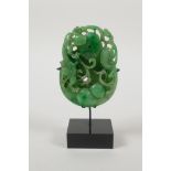 A Chinese apple jade carving of kylin, gourds and a pi disc, mounted on a display stand, 5" high