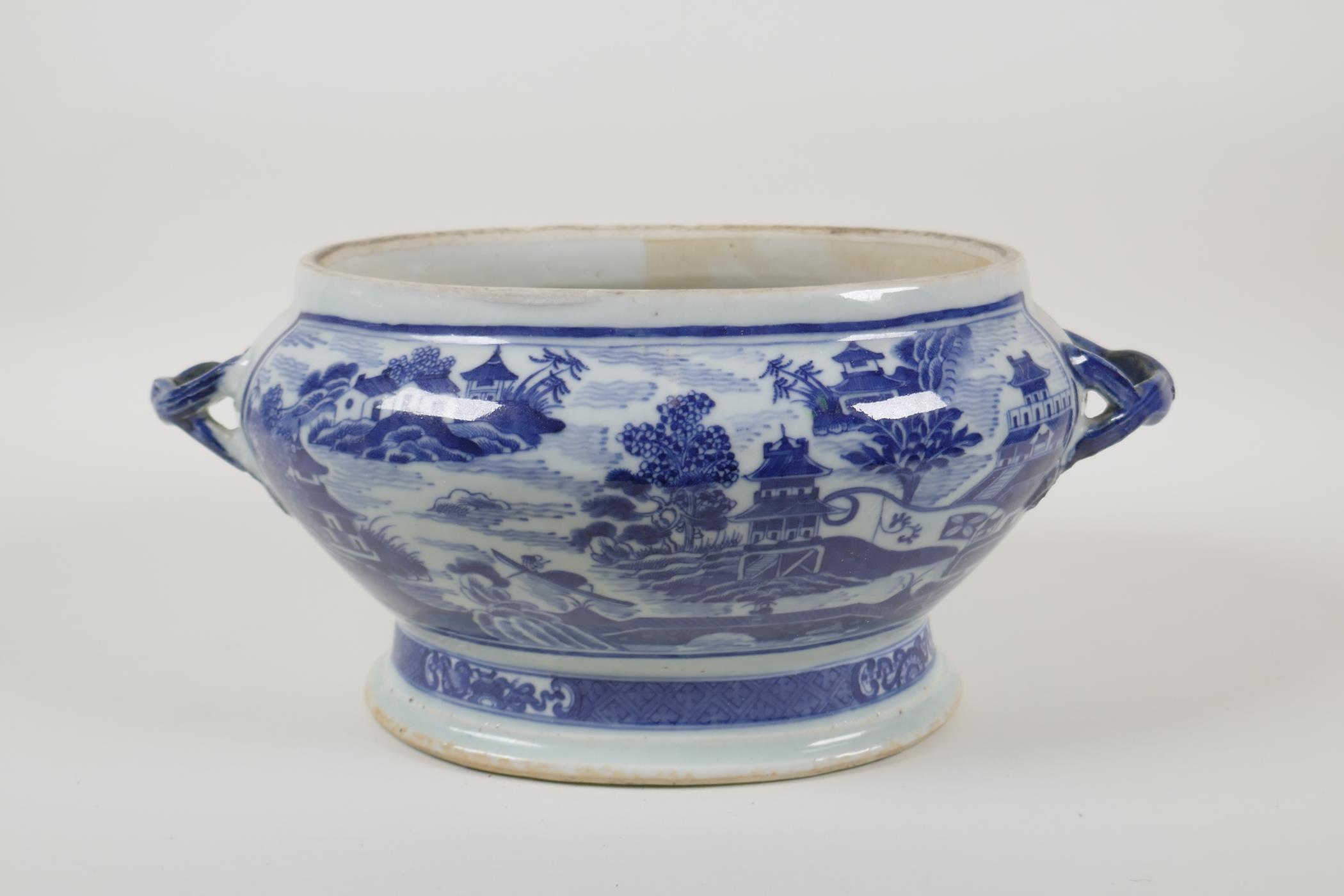 A Chinese blue and white porcelain export ware two handled pot/dish, with riverside landscape