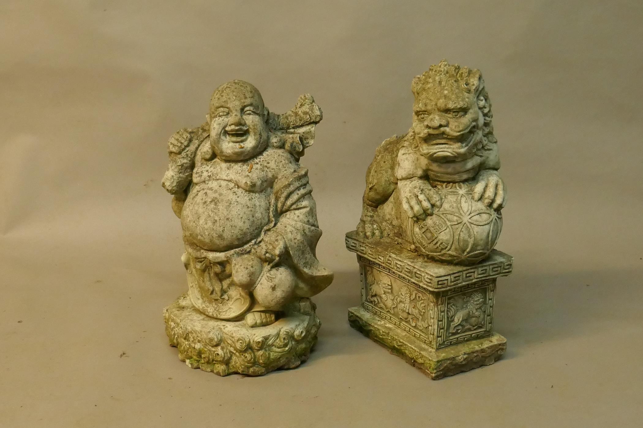 A concrete garden figure of a smiling Buddha and another of a temple dog, 20" high