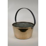 An antique bronze jam pan with iron handle, 13" diameter, 16" high