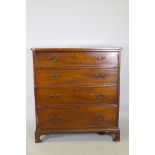 A C19th mahogany chest of four long drawers, with boxwood stringing, cockbeaded detail and brass