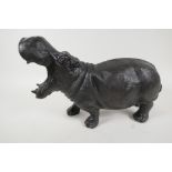 A bronzed metal figure of a hippopotamus, 14" long