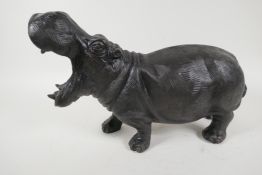 A bronzed metal figure of a hippopotamus, 14" long