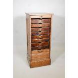 A tambour front oak filling cabinet, AF, lacks key & bottom drawer. 19" x 17½" x 45" high