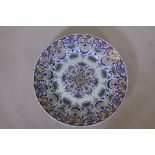 A large continental faience ceramic charger with oriental style decoration, 24" diameter