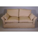 A Duresta two seater sofa with off white linen upholstery, recently recovered, 71" wide
