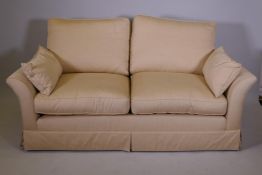 A Duresta two seater sofa with off white linen upholstery, recently recovered, 71" wide