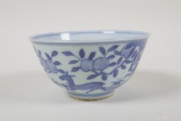A blue and white porcelain rice bowl, decorated with deer and peaches, Chinese 6 character mark to