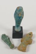 An Egyptian turquoise glazed faience shabti, and another smaller, together with a turquoise glazed