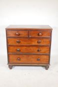 A early C19th mahogany chest, of 2 over 3 graduated drawers, raised on turned supports, 36" x 19½" x