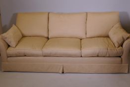 A Duresta three seater sofa with off white linen upholstery, recently re-covered, 101" wide