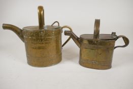 Two vintage brass indoor watering cans, largest 10" high