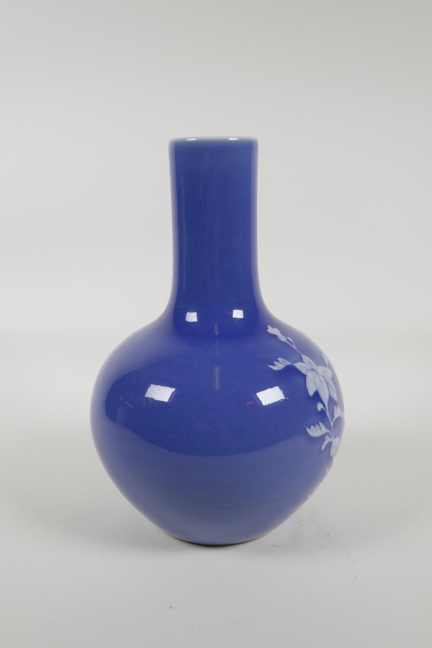A blue glazed porcelain vase with white enamelled floral decoration, Chinese Qianlong seal mark to - Image 3 of 5