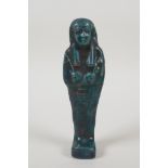 An Egyptian turqoise glazed faience shabti, 7½" high