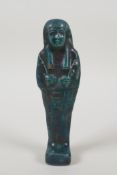 An Egyptian turqoise glazed faience shabti, 7½" high