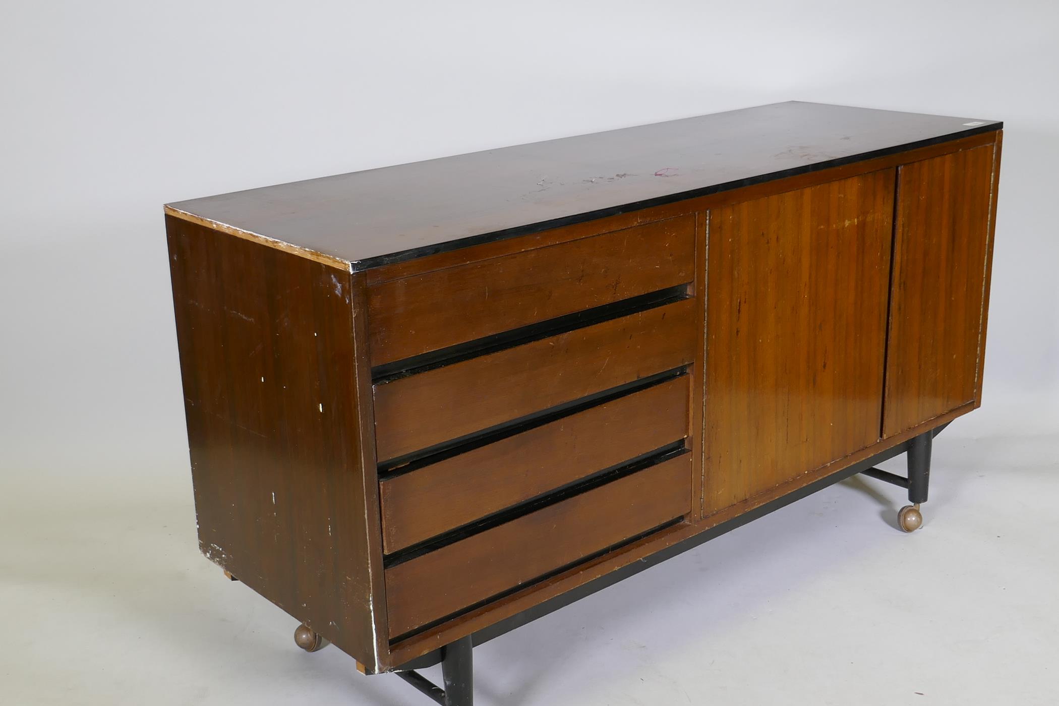 A mid-century mahogany sideboard with ebonised detail, comprising two cupboards and four drawers, - Image 5 of 6