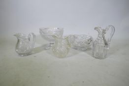 An antique cut glass pedestal bowl, 8" high, three jugs and another bowl, A/F, faults