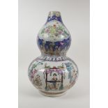 A Chinese polychrome enamelled porcelain double gourd vase, with decorative panels depicting figures