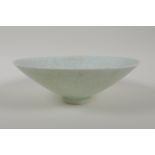 A Ru ware style celadon glazed conical bowl with incised underglaze decorated to the centre, 7"