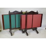 A pair of Victorian mahogany fire screens with sliding extendable panels, raised on scroll end