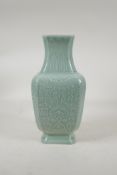 A celadon glazed porcelain vase with archaic style underglaze decoration, impressed Chinese seal