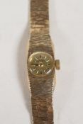 A 9ct gold lady's Rotary wrist watch with 9ct gold strap, 15g with crystal