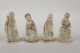 A set of four Japanese Meiji period ivory okimono carved in the form of deities, signed to base, 3½"