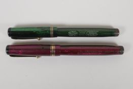 Two 'Swan' Mabie Todd leverless fountain pens with reptile skin effect cases, both with 14ct nibs