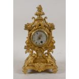 A C19th French ormolu mantel clock, with pagoda shaped top and dolphin mounts, raised on hoof