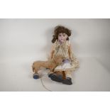 A C19th German doll with bisque head, composition limbs, four teeth and sleeping eyes, 19" tall, A/