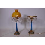 A pair of blue glass and brass mounted lustre table lamps, lacking a shade and seven drops, 26" high