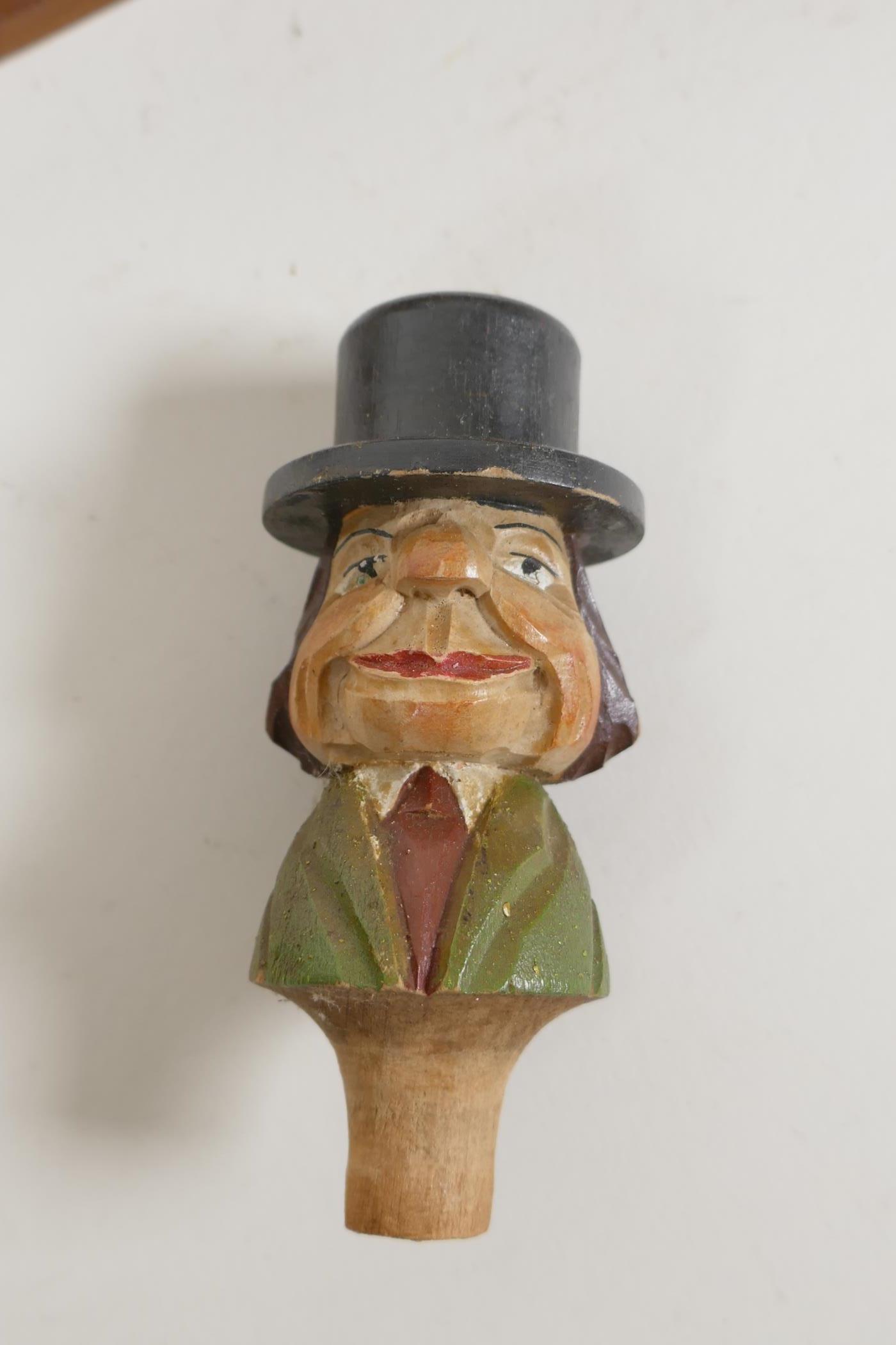 A set of four carved and painted Black Forest figural caricature bottle stoppers/pourers, in a - Image 3 of 7