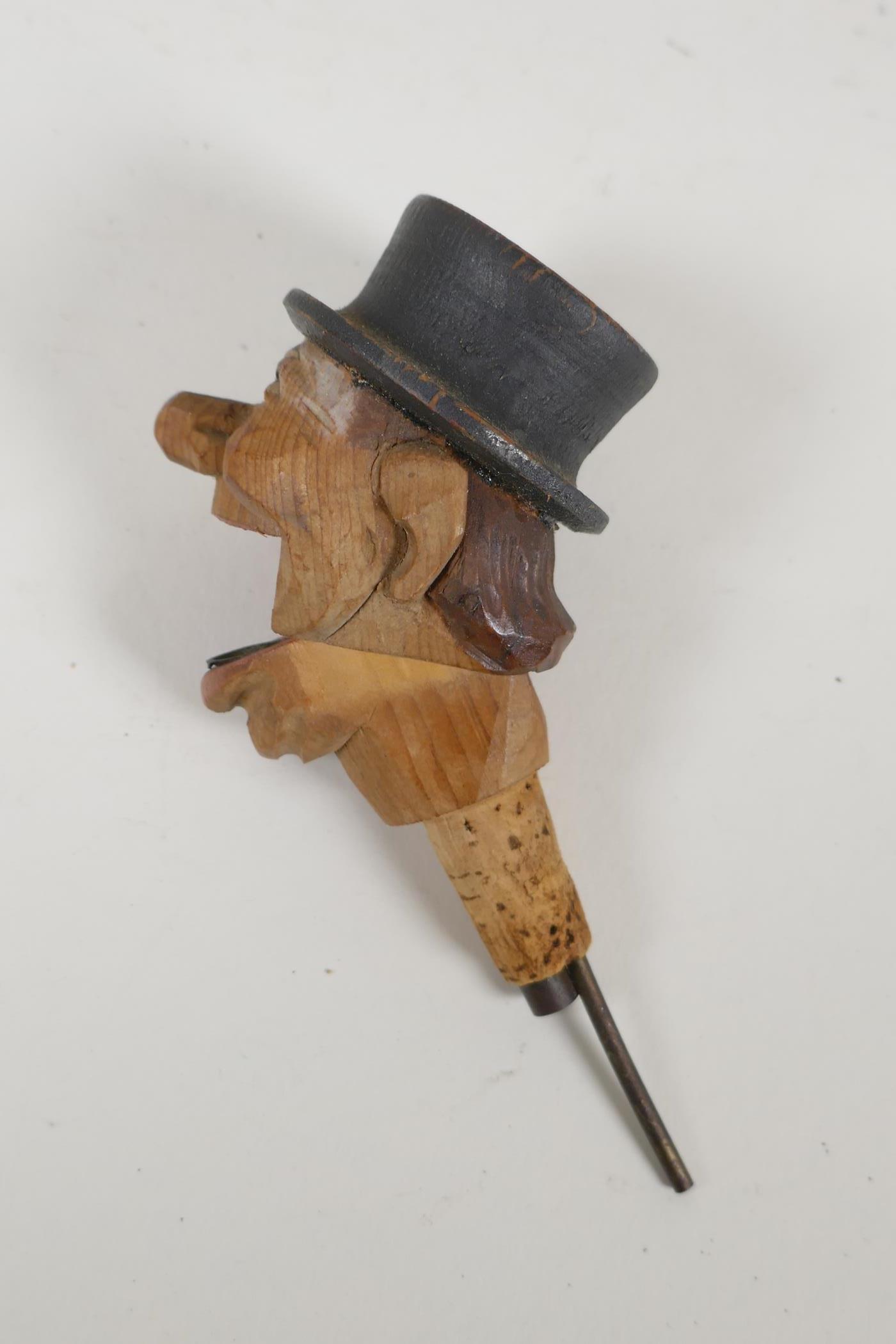 A set of four carved and painted Black Forest figural caricature bottle stoppers/pourers, in a - Image 6 of 7
