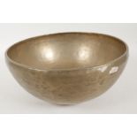 A Tibetan brass singing bowl, 11½" diameter