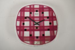 A vintage ceramic 'Gingham' pattern wall clock with Smiths eight day movement, retailed by T.