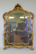 An Italian giltwood sectional wall mirror, mid C20th, 39" x 57"