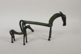 Two Indian naive bronze horses, largest 9" long