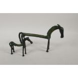 Two Indian naive bronze horses, largest 9" long