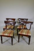 Four mahogany bar back dining chairs with carved details, raised on reeded tapered front legs, A/
