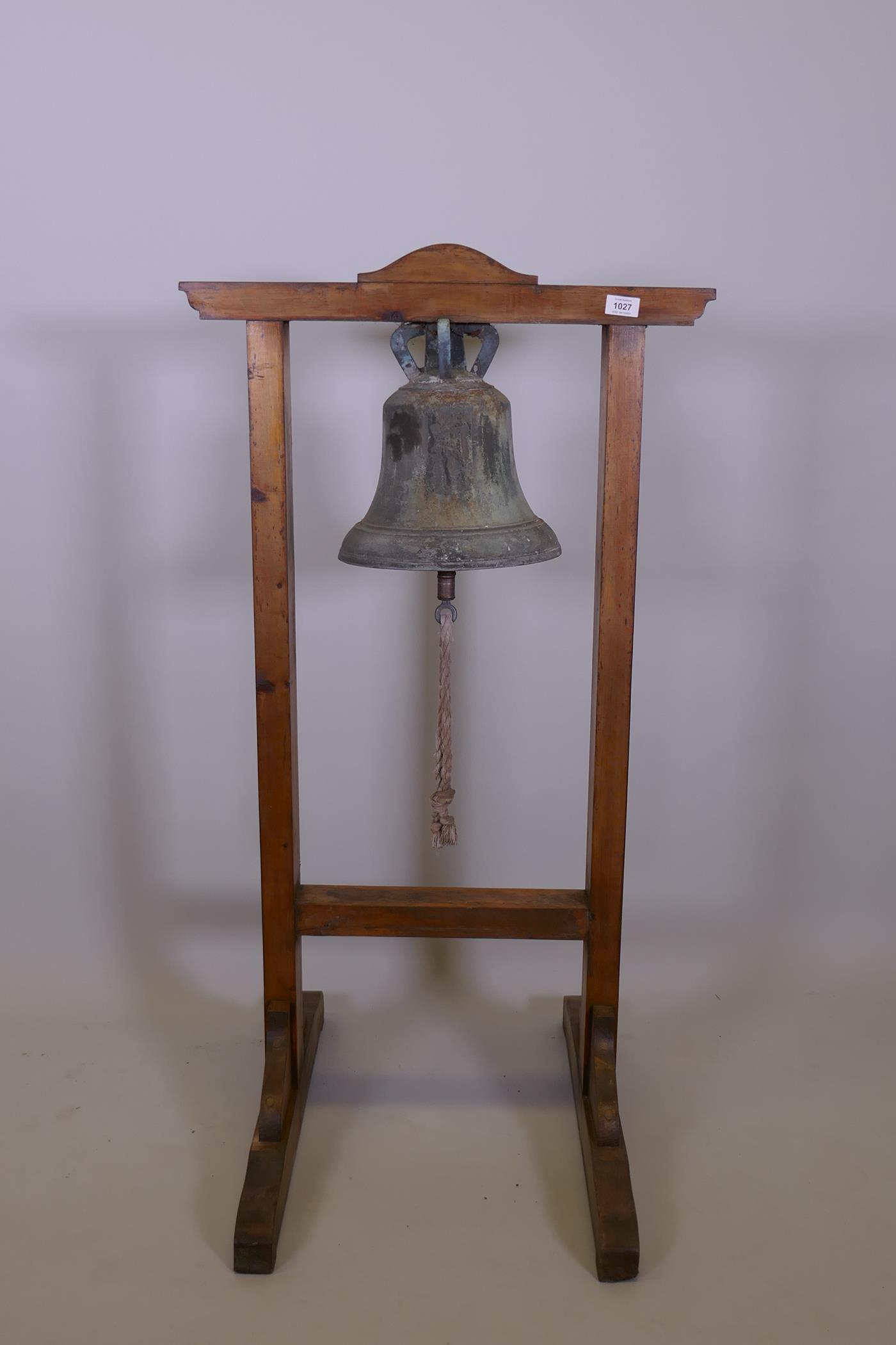 Antique bronze bell, mounted in a pine frame, 45" x 26" x 25"