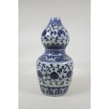 A blue and white porcelain double gourd vase with scrolling lotus flower decoration, Chinese 6