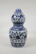 A blue and white porcelain double gourd vase with scrolling lotus flower decoration, Chinese 6