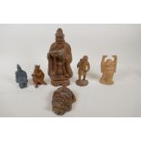 A Japanese Meiji period carved boxwood okimono figure of a traveller (signed to base), and an
