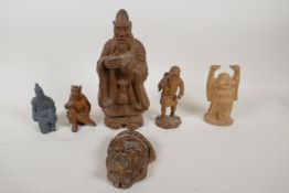 A Japanese Meiji period carved boxwood okimono figure of a traveller (signed to base), and an