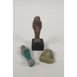 Two Egyptian glazed faience shabtis, together with a turquoise glazed faience shabti head, largest