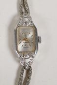 A lady's platinum and diamond set cocktail watch, with 9ct white gold strap, 11g gross weight with