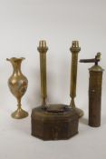 An antique Eastern brass and iron spice mill, a pair of spring pusher candlesticks, 12" high, a