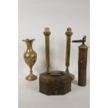 An antique Eastern brass and iron spice mill, a pair of spring pusher candlesticks, 12" high, a