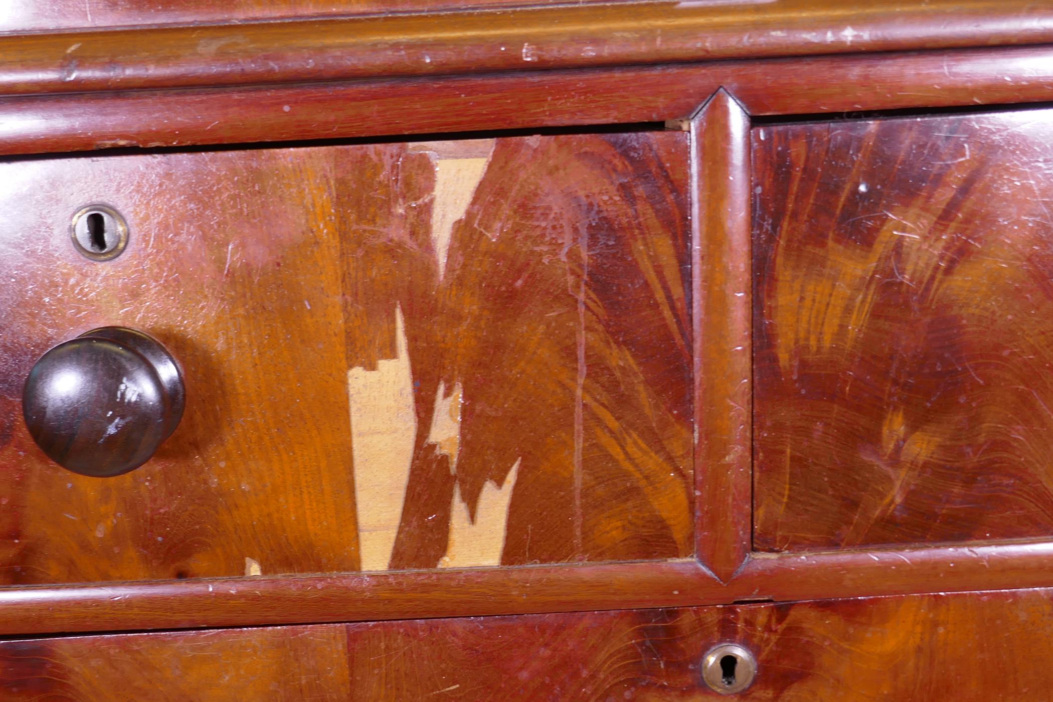 A Victorian figured mahogany chest of two over three drawers with rounded corners, raised on bun - Image 4 of 5